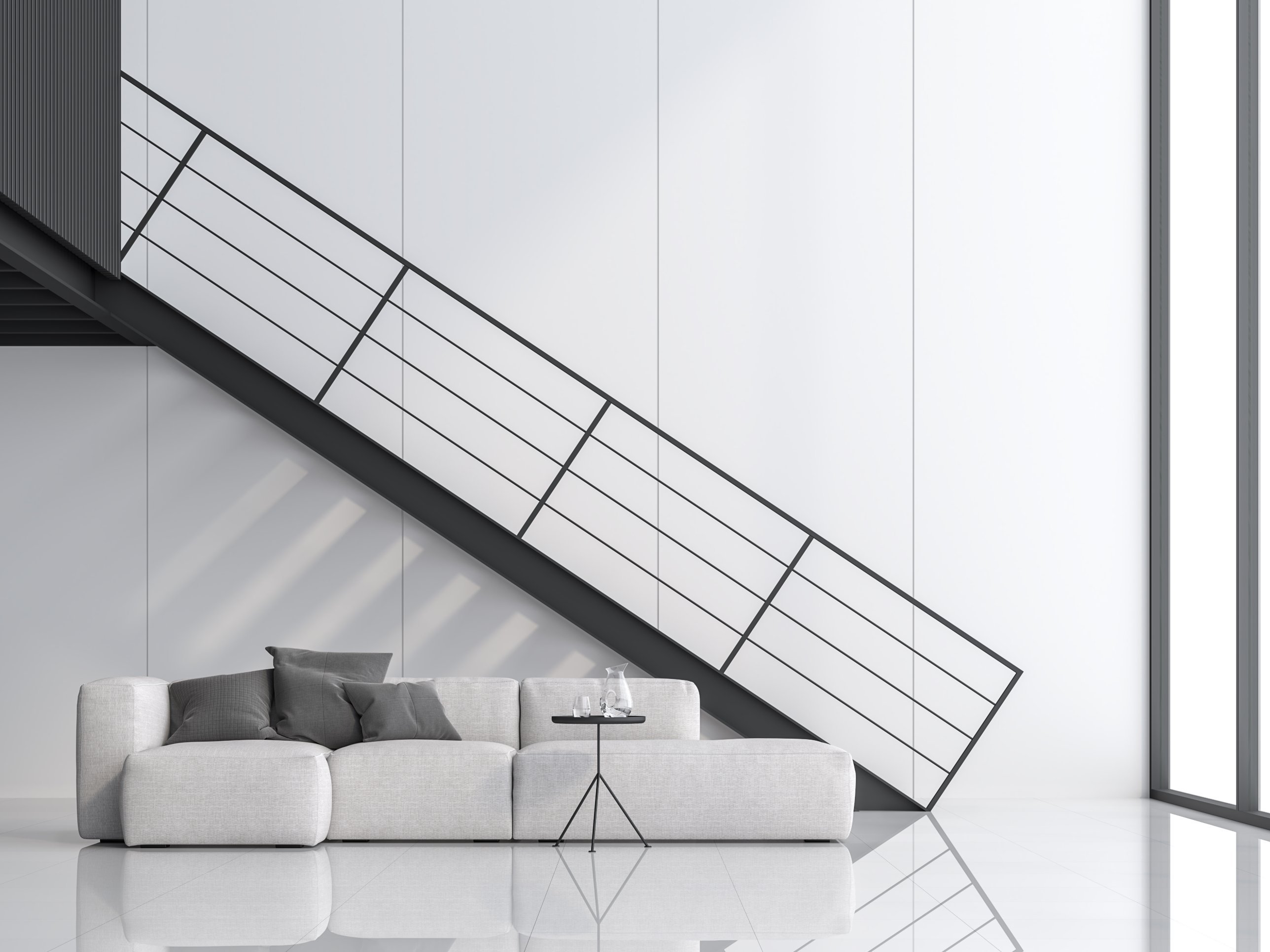 Black steel staircase with flat-bar balustrade in a white living space